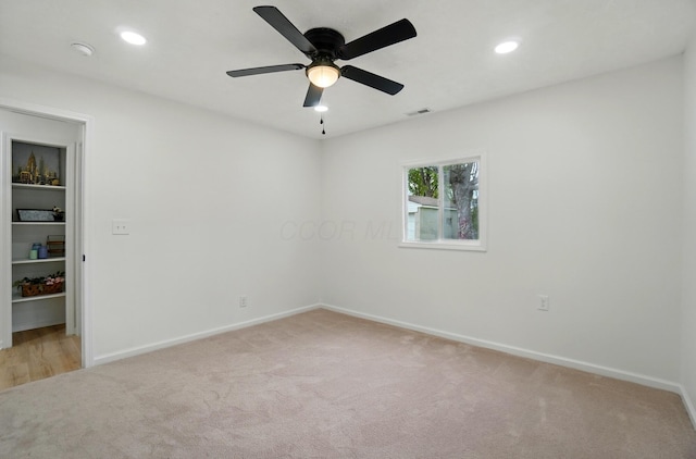empty room with visible vents, baseboards, light colored carpet, recessed lighting, and a ceiling fan