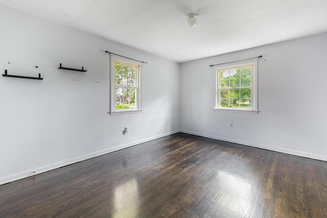 624 W 1st St, Springfield, OH 45504 - unfurnished room with wood finished floors, baseboards, and a textured ceiling