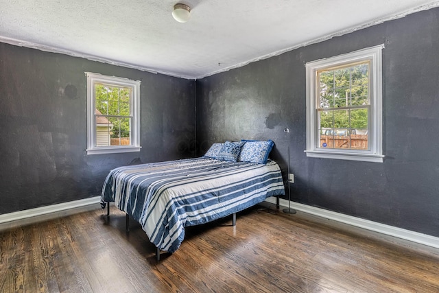 624 W 1st St, Springfield, OH 45504 - bedroom featuring wood finished floors, baseboards, and a textured ceiling