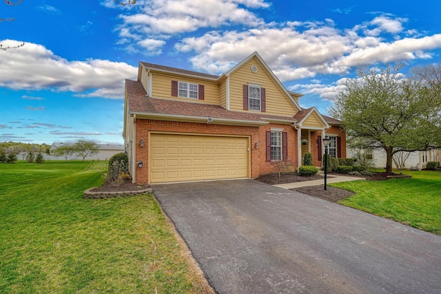 traditional home with driveway, a garage, a front lawn, and brick siding