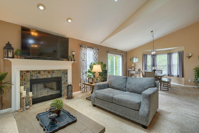 living room featuring baseboards, vaulted ceiling, recessed lighting, a fireplace, and carpet floors