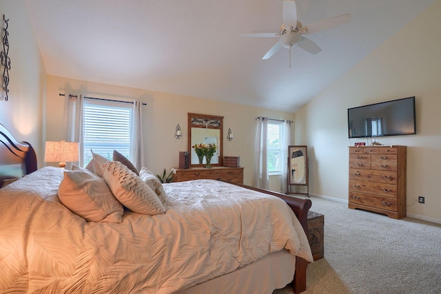 bedroom featuring carpet floors, baseboards, ceiling fan, and lofted ceiling
