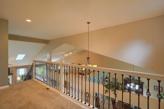 hall with recessed lighting, carpet, a notable chandelier, and lofted ceiling
