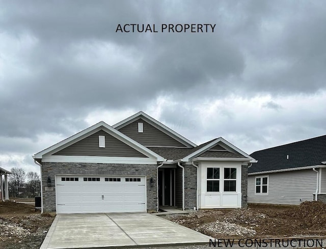 ranch-style house featuring stone siding, concrete driveway, a garage, and a shingled roof