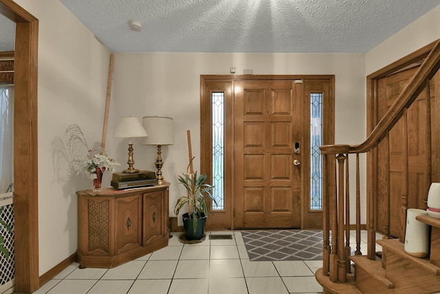 2520 Mccutcheon Rd, Columbus, OH 43219 - entrance foyer featuring a textured ceiling, visible vents, and light tile patterned floors