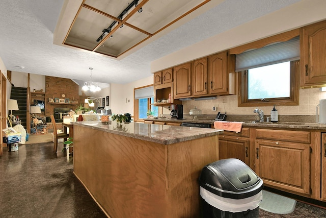 2520 Mccutcheon Rd, Columbus, OH 43219 - kitchen featuring a textured ceiling, plenty of natural light, and a center island