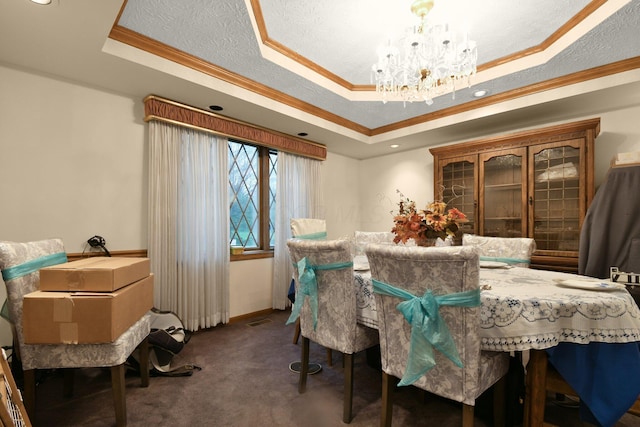 2520 Mccutcheon Rd, Columbus, OH 43219 - carpeted dining area featuring ornamental molding, a tray ceiling, visible vents, and a chandelier