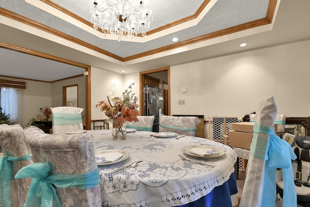 2520 Mccutcheon Rd, Columbus, OH 43219 - dining room with crown molding, a textured ceiling, a chandelier, recessed lighting, and a tray ceiling