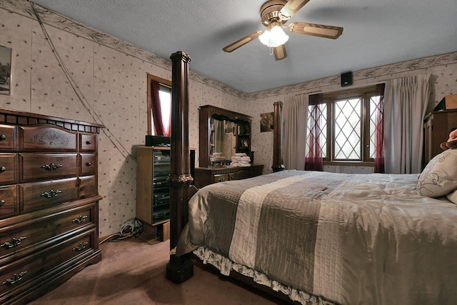 2520 Mccutcheon Rd, Columbus, OH 43219 - carpeted bedroom with wallpapered walls and ceiling fan