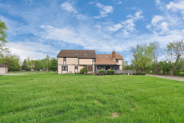 2520 Mccutcheon Rd, Columbus, OH 43219 - exterior space featuring a lawn, stucco siding, and a chimney