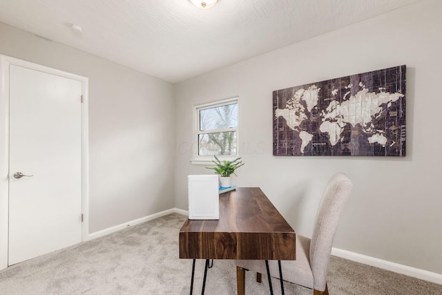 office with baseboards and carpet floors