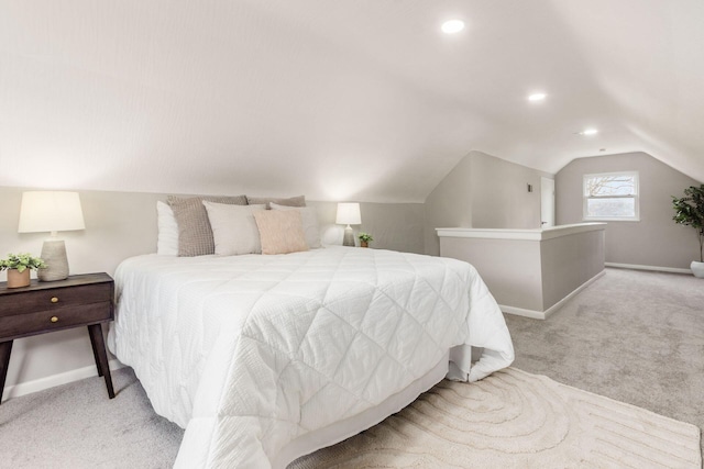 carpeted bedroom featuring baseboards, vaulted ceiling, and recessed lighting