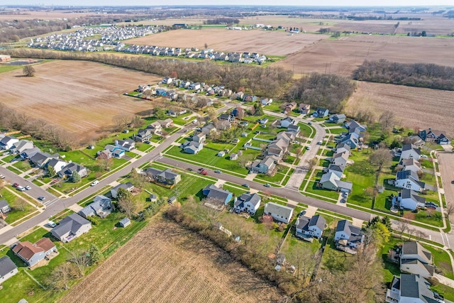 drone / aerial view featuring a rural view and a residential view