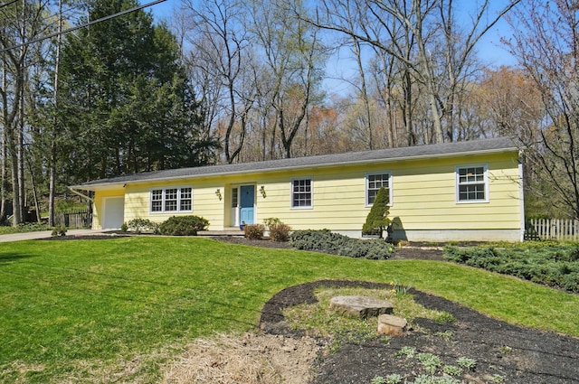 105 Chapin Pl, Granville, OH 43023 - single story home featuring an attached garage, driveway, a front lawn, and fence