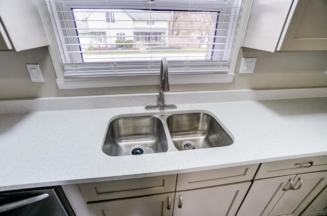 153 N High St, Mount Victory, OH 43340 - interior details featuring gray cabinets, a sink, light stone countertops, and stainless steel dishwasher