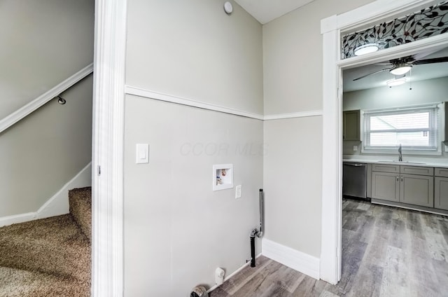 153 N High St, Mount Victory, OH 43340 - clothes washing area with a sink, laundry area, light wood-style floors, ceiling fan, and hookup for a washing machine