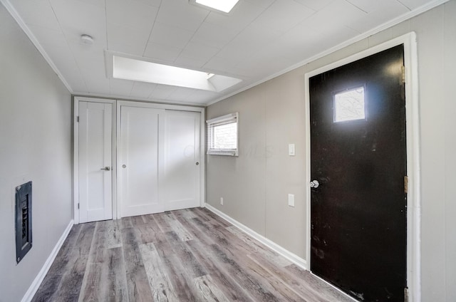 153 N High St, Mount Victory, OH 43340 - interior space with baseboards, a closet, crown molding, and wood finished floors