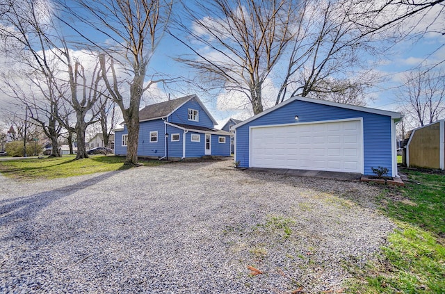 153 N High St, Mount Victory, OH 43340 - view of front of property with a detached garage and an outdoor structure