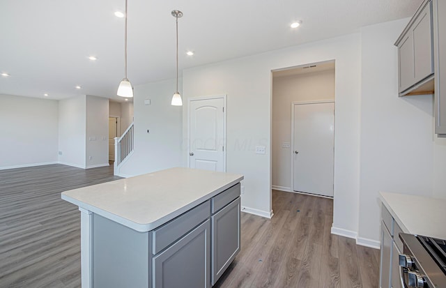 5537 Violet St Lot 367, South Bloomfield, OH 43103 - kitchen with gray cabinets, light wood finished floors, light countertops, a center island, and recessed lighting