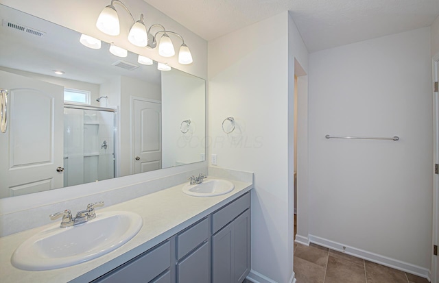 5537 Violet St Lot 367, South Bloomfield, OH 43103 - bathroom with double vanity, a shower stall, and tile patterned flooring