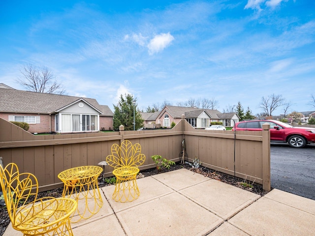view of patio with a fenced backyard and a residential view