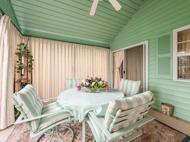 exterior space with ceiling fan