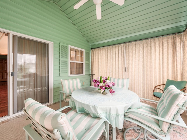 sunroom / solarium featuring ceiling fan