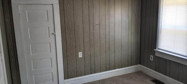 371 Hensel Ave, Springfield, OH 45505 - empty room featuring wood walls, dark colored carpet, and visible vents