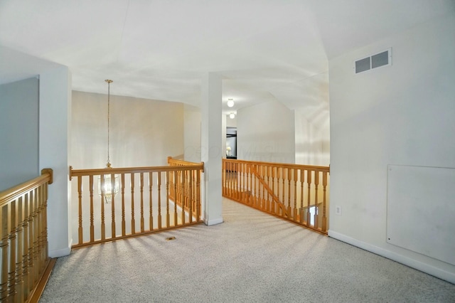 unfurnished room with baseboards, visible vents, and carpet