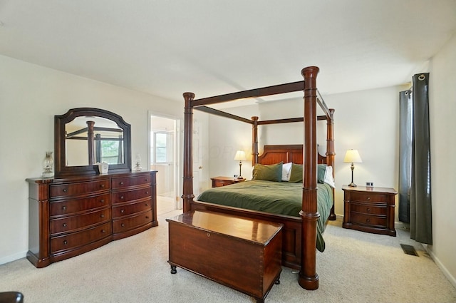 carpeted bedroom featuring baseboards