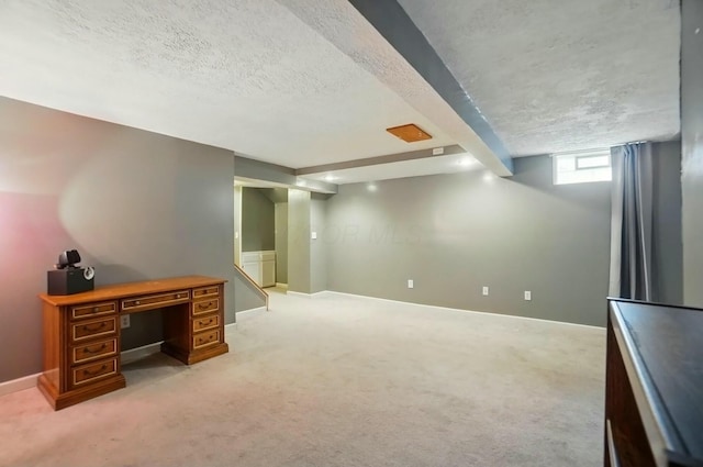interior space with baseboards, a textured ceiling, and light colored carpet