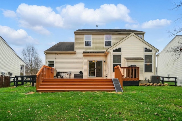 rear view of house with cooling unit, fence, a wooden deck, a shingled roof, and a lawn
