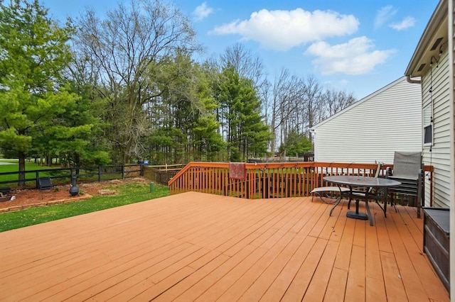 wooden terrace with fence and outdoor dining area
