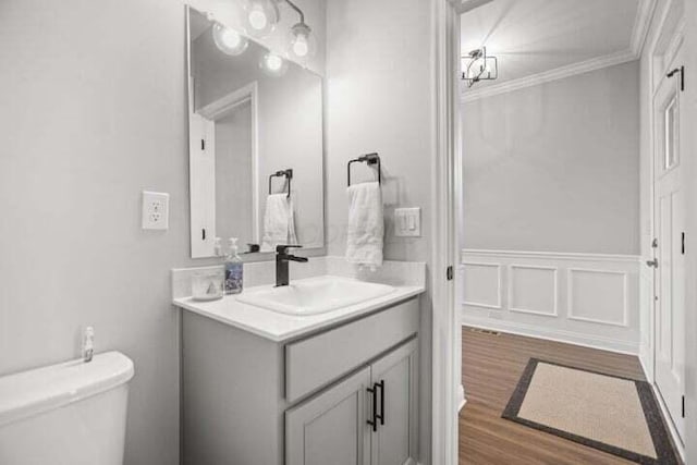 6003 Honey Farm Way, Grove City, OH 43123 - half bath featuring wood finished floors, vanity, toilet, a decorative wall, and wainscoting