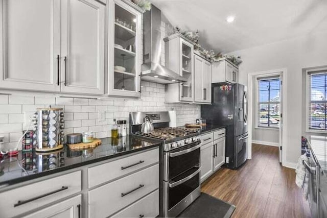 6003 Honey Farm Way, Grove City, OH 43123 - kitchen featuring double oven range, dark wood-style floors, wall chimney range hood, backsplash, and freestanding refrigerator