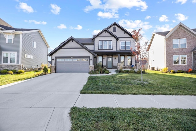 6003 Honey Farm Way, Grove City, OH 43123 - craftsman-style house with driveway, covered porch, stone siding, an attached garage, and a front lawn
