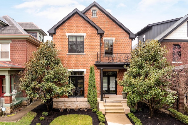 251 E Deshler Ave, Columbus, OH 43206 - view of front of property featuring french doors, brick siding, and a balcony