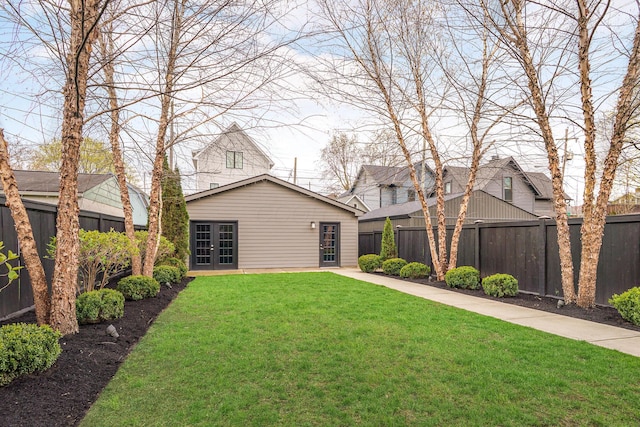 251 E Deshler Ave, Columbus, OH 43206 - view of front facade featuring french doors, a front lawn, and a fenced backyard