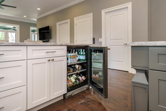 251 E Deshler Ave, Columbus, OH 43206 - bar with wine cooler, dark wood finished floors, recessed lighting, ceiling fan, and ornamental molding