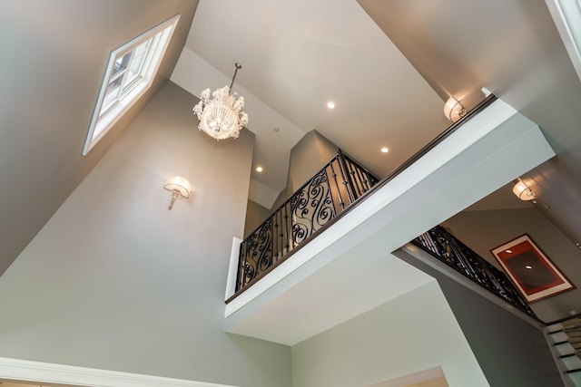 251 E Deshler Ave, Columbus, OH 43206 - stairway featuring a high ceiling, recessed lighting, and a notable chandelier