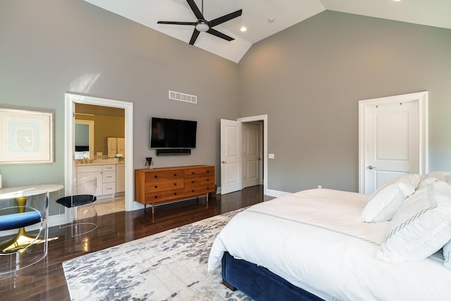 251 E Deshler Ave, Columbus, OH 43206 - bedroom with baseboards, visible vents, wood finished floors, high vaulted ceiling, and connected bathroom