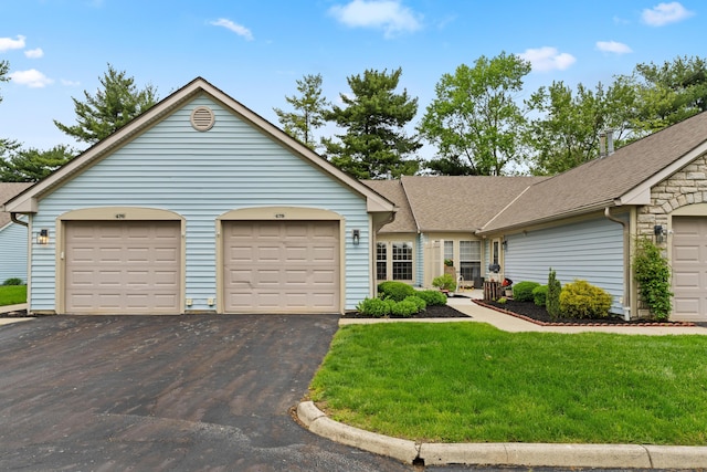 478 Three Oaks Ct, Columbus, OH 43230 - single story home with asphalt driveway, a front lawn, roof with shingles, and an attached garage
