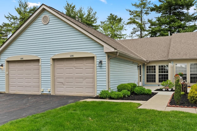 478 Three Oaks Ct, Columbus, OH 43230 - view of front of home with roof with shingles, a front lawn, and a garage