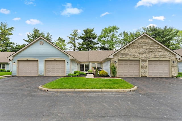 478 Three Oaks Ct, Columbus, OH 43230 - ranch-style house featuring stone siding, a front lawn, community garages, and roof with shingles