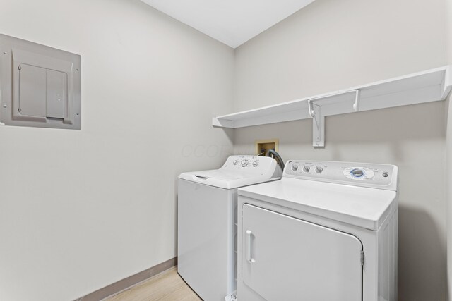 478 Three Oaks Ct, Columbus, OH 43230 - laundry area with separate washer and dryer, baseboards, electric panel, and light wood finished floors