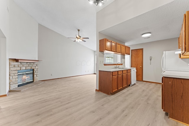 478 Three Oaks Ct, Columbus, OH 43230 - kitchen with a ceiling fan, open floor plan, light countertops, brown cabinets, and vaulted ceiling