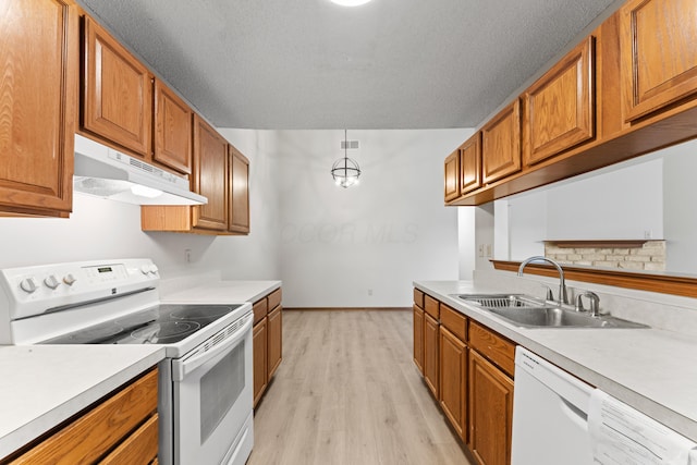 478 Three Oaks Ct, Columbus, OH 43230 - kitchen featuring white appliances, under cabinet range hood, a sink, light countertops, and brown cabinets