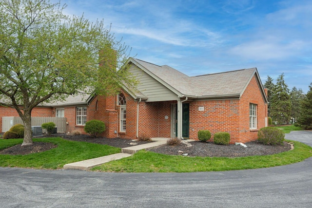 3870 Sandstone Cir, Powell, OH 43065 - ranch-style house featuring brick siding, a front lawn, and fence