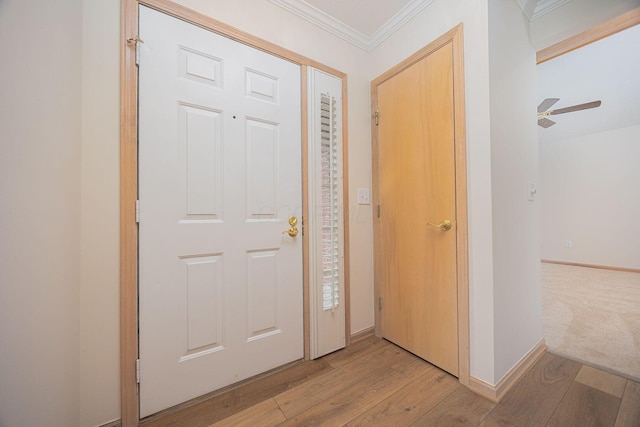 3870 Sandstone Cir, Powell, OH 43065 - foyer with light wood-type flooring, baseboards, ceiling fan, and crown molding