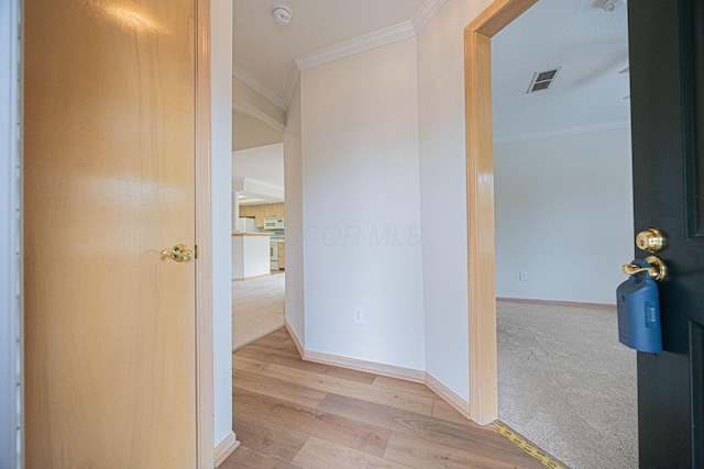 3870 Sandstone Cir, Powell, OH 43065 - corridor featuring wood finished floors, visible vents, ornamental molding, carpet floors, and baseboards